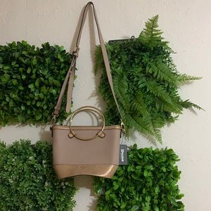 Small purse with strap and handles. New.